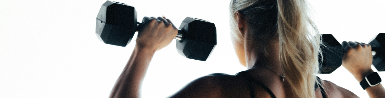 woman working out with dumbells