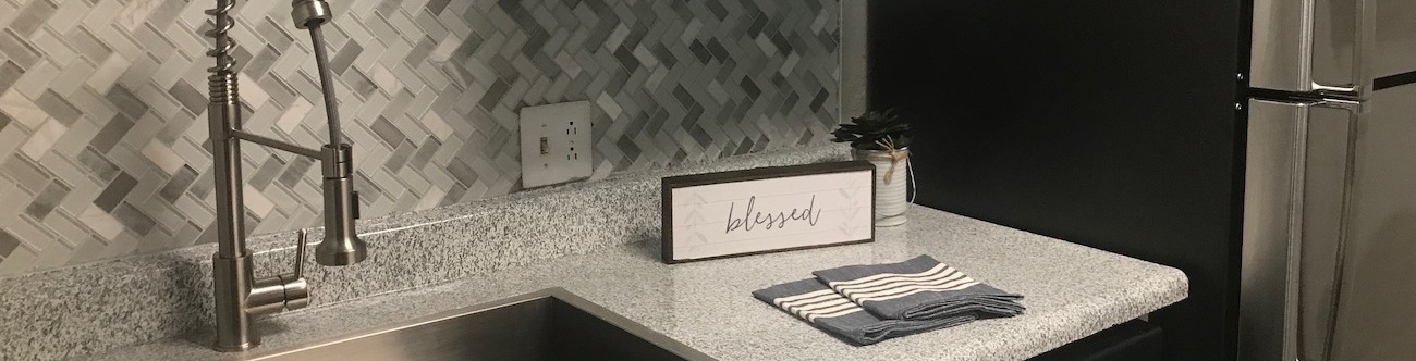 kitchen interior including appliances and designer backsplash